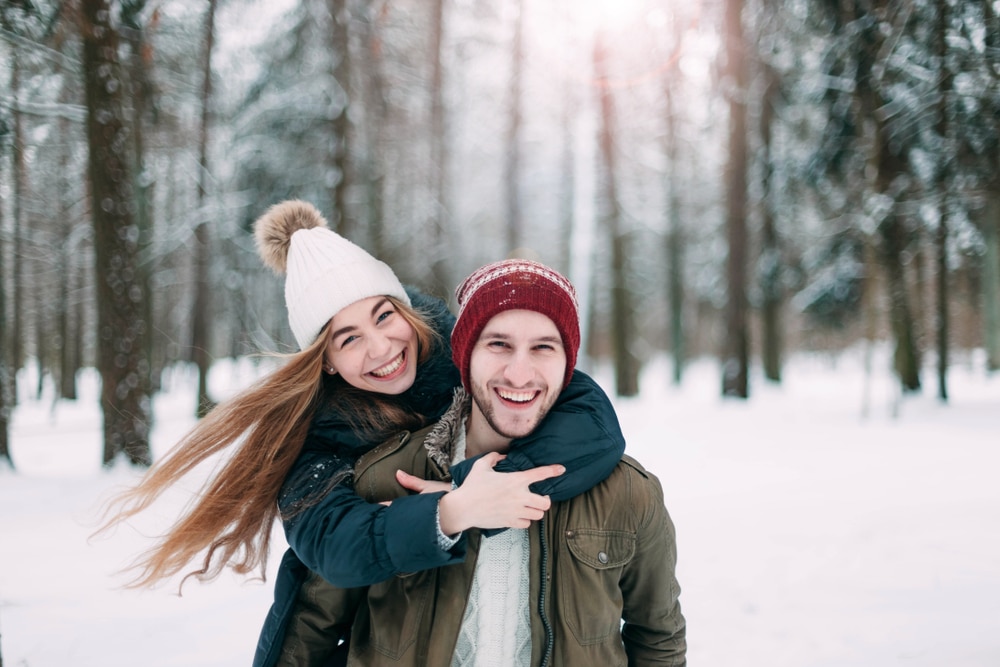 A young couple enjoying the best things to do in Galena This Winter