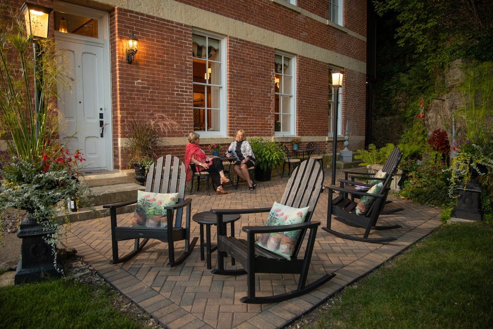 Women unwinding on our exterior patio in the afternoon after a day golfing near our Galena Bed and Breakfast
