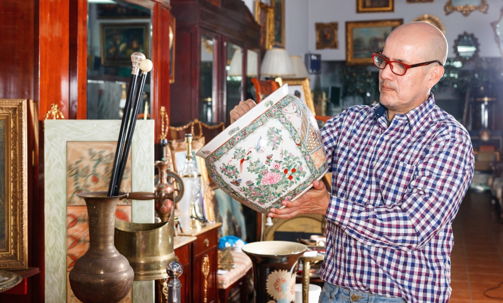 Man browsing antiques at Galena Antique Mall and other antique stores in Galena