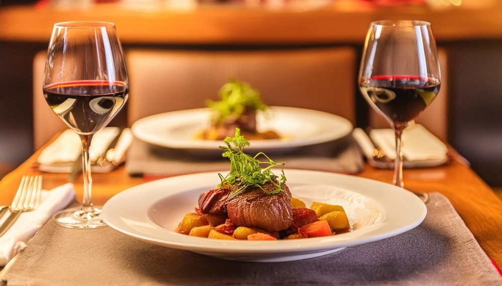 Plated dish with wine at one of the most romantic Galena restaurants