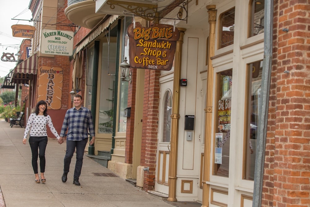 Couple walking, shopping, and enjoying downtown Galena during their romantic getaways near Chicago