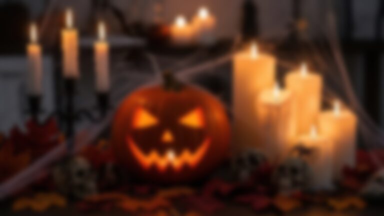 Welcome 6 A jac-o-lantern with white candles surrounding it during a spooky night on Galena ghost tours.