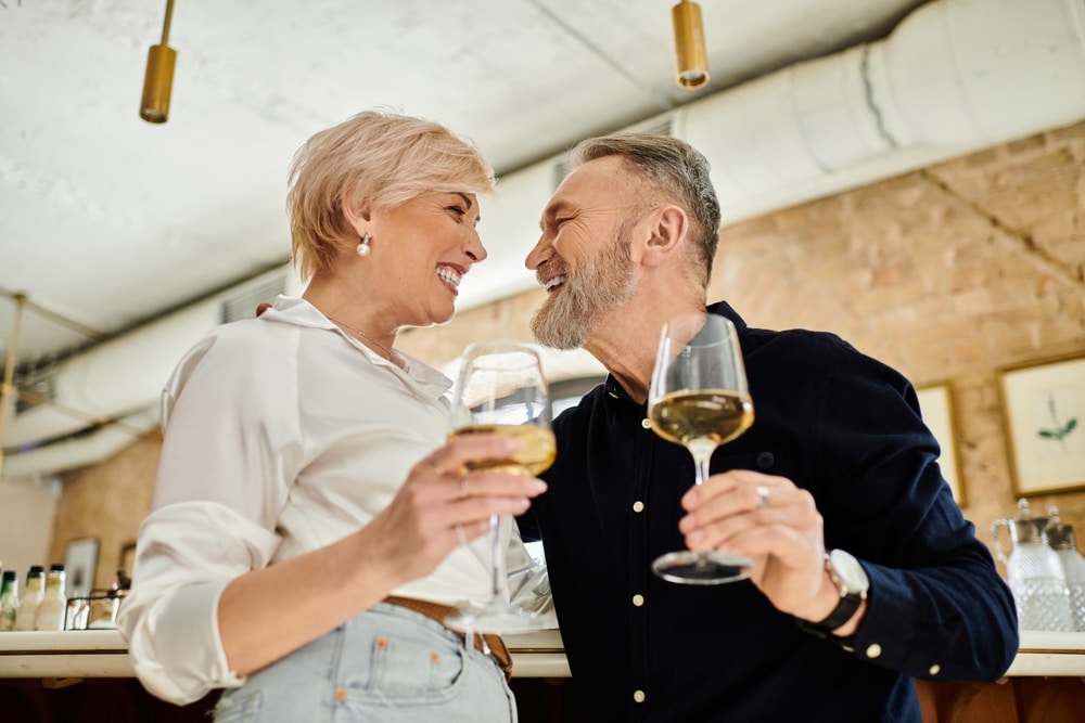 Couple enjoying a glass of wine during their romantic getaways in Galena, IL